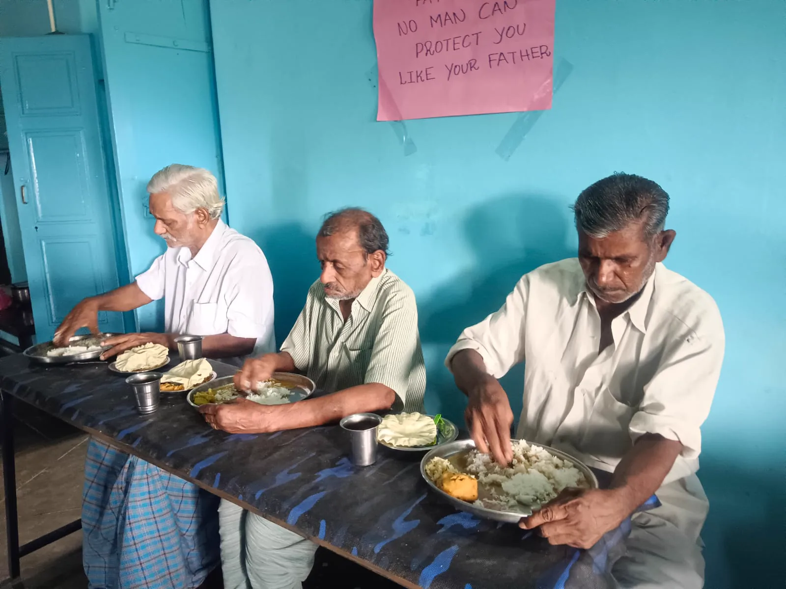 Residents seated for a meal in the dining room